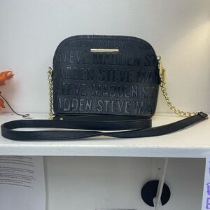Steve Madden black faux leather crossbody bag with an embossed logo design